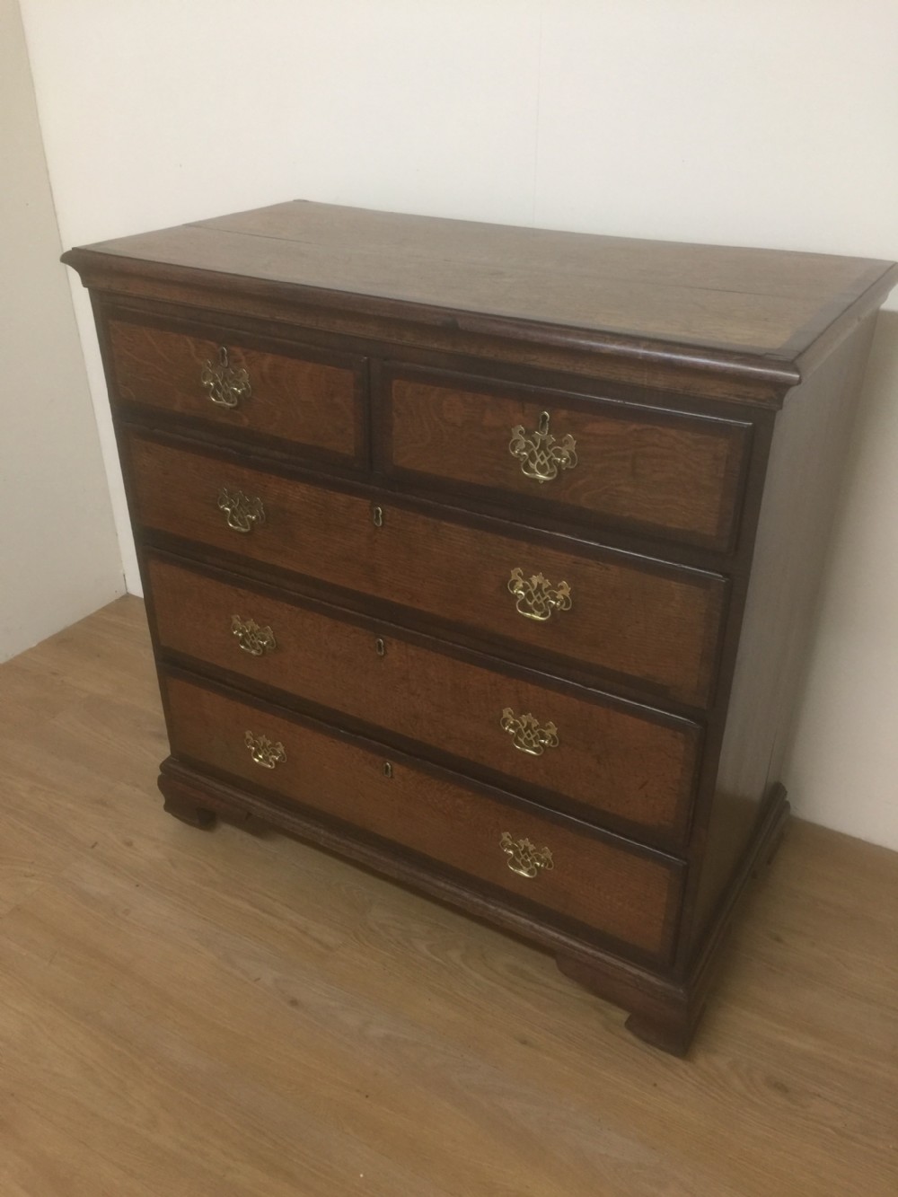 Georgian golden oak and crossbanded mahogany Chest Of Drawers. 
