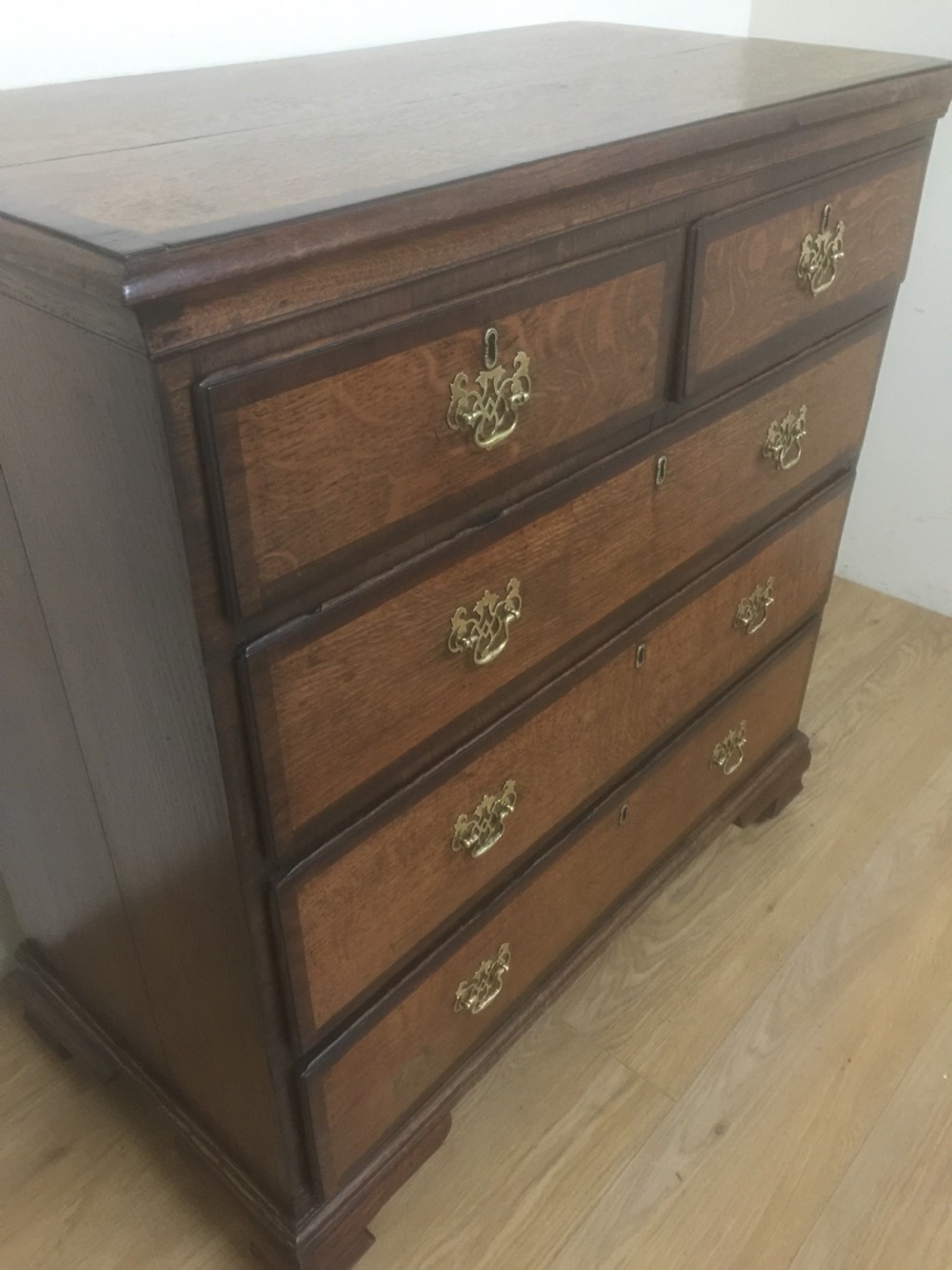 Georgian golden oak and crossbanded mahogany Chest Of Drawers.  View V