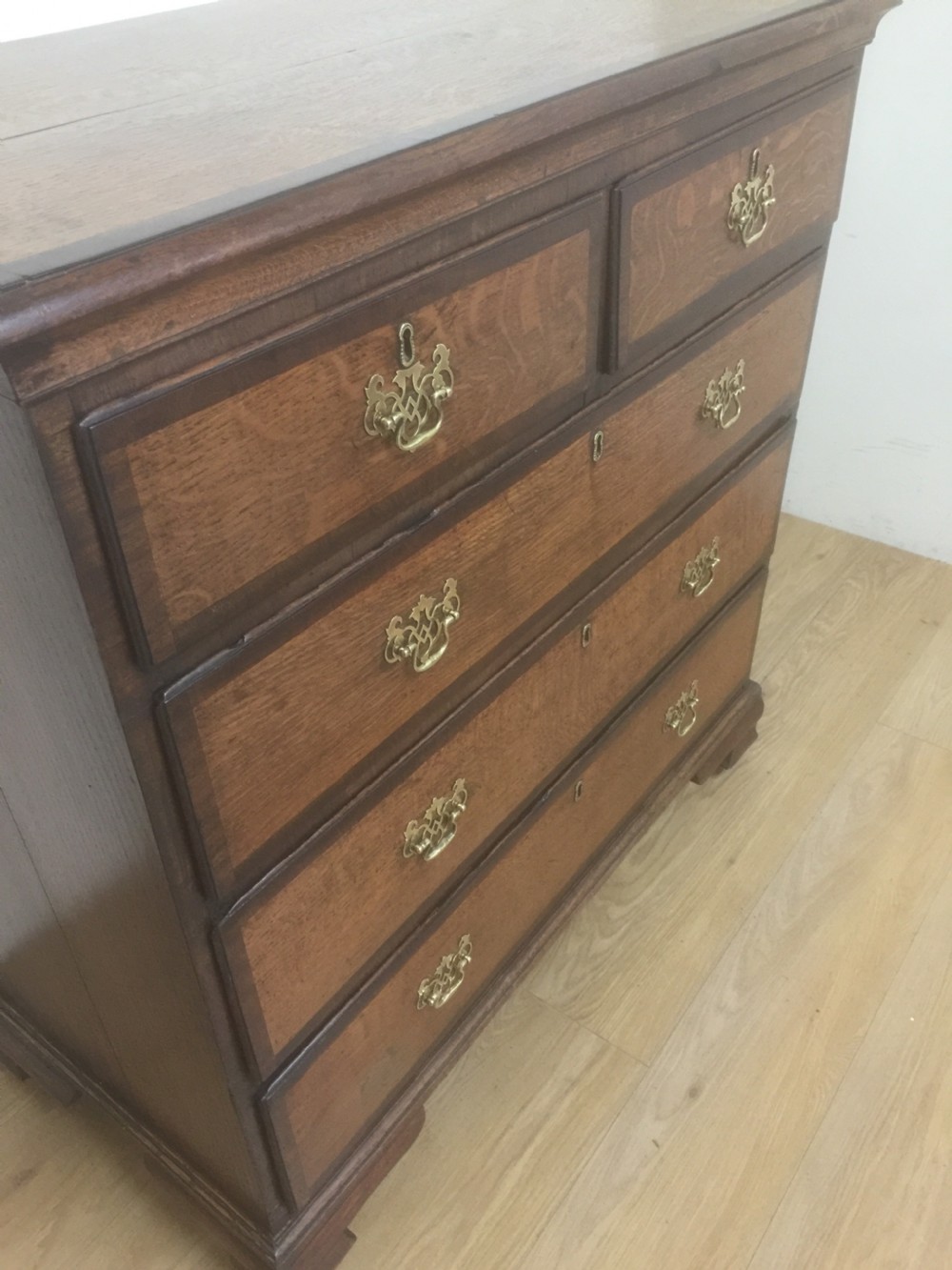Georgian golden oak and crossbanded mahogany Chest Of Drawers.  View VII