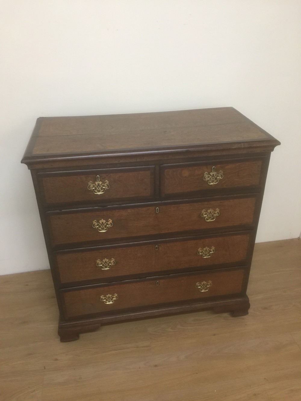 Georgian golden oak and crossbanded mahogany Chest Of Drawers.  View X