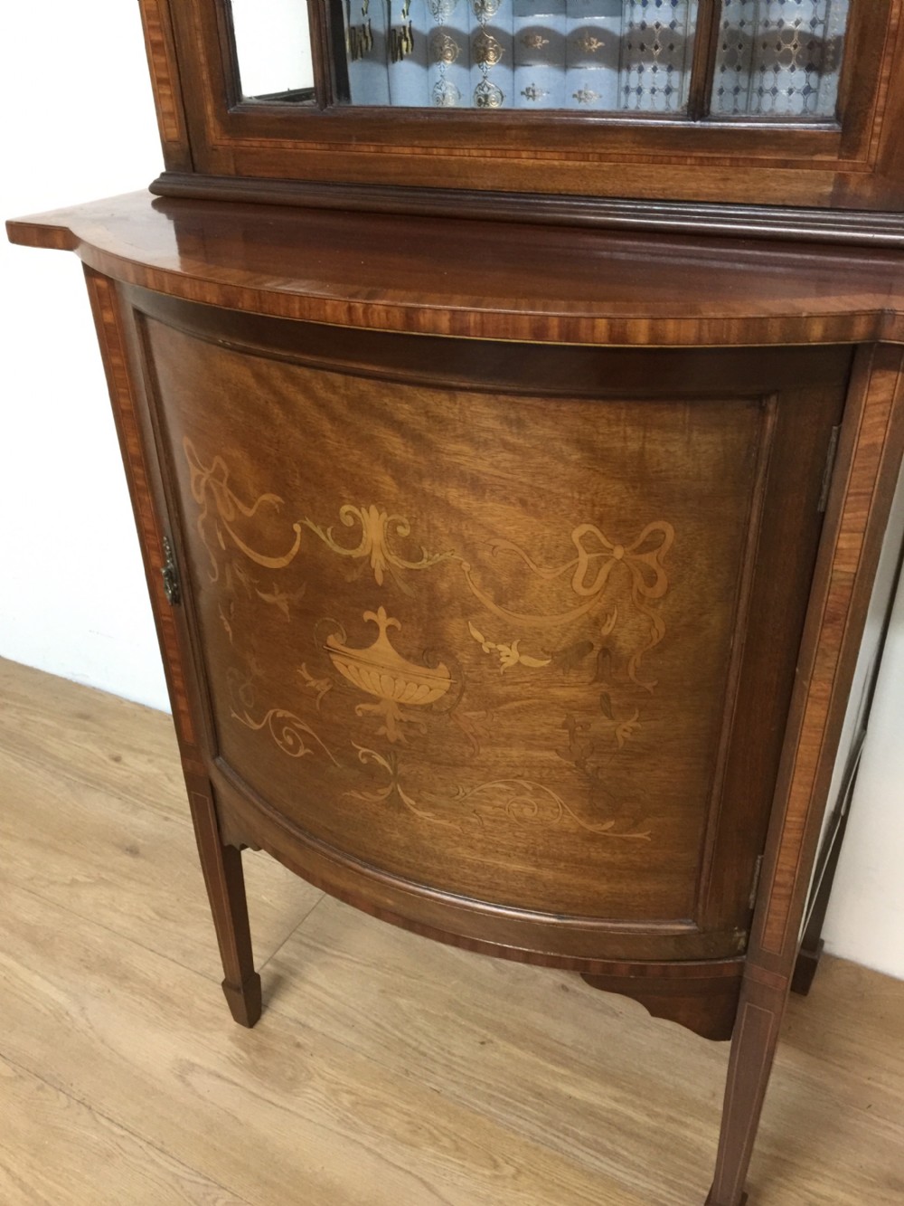 Edwardian Inlaid mahogany cabinet over cupboard on tapered feet  View II