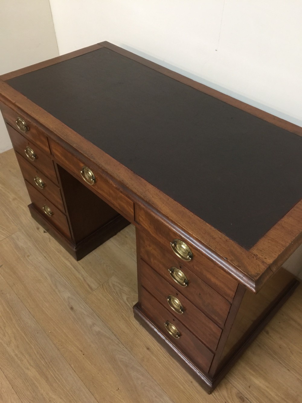 Nineteenth century mahogany twin Pedestal desk with brass oval plate handles View III