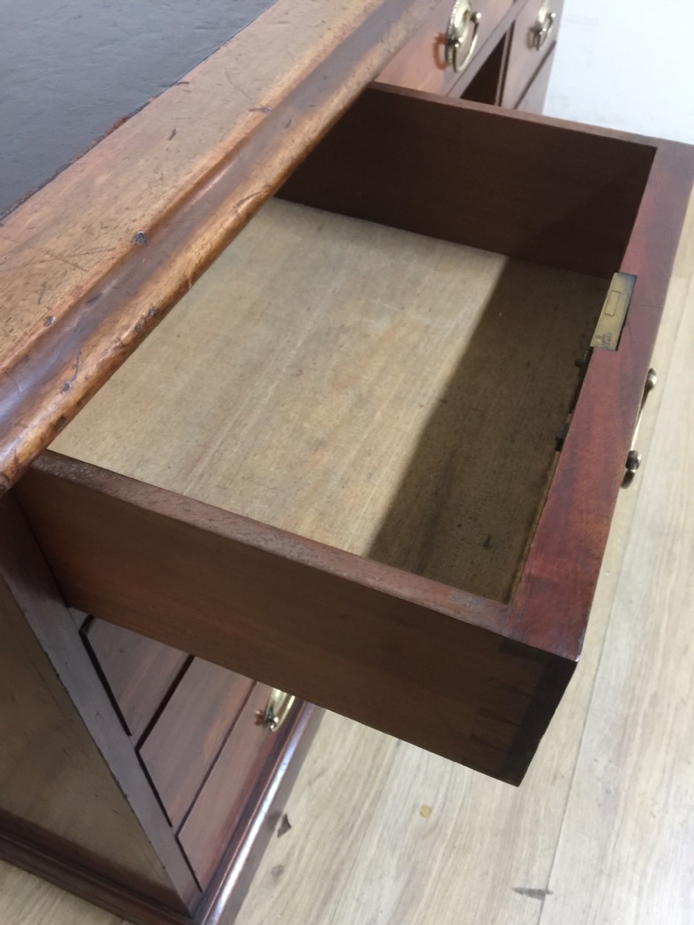 Nineteenth century mahogany twin Pedestal desk with brass oval plate handles View VI