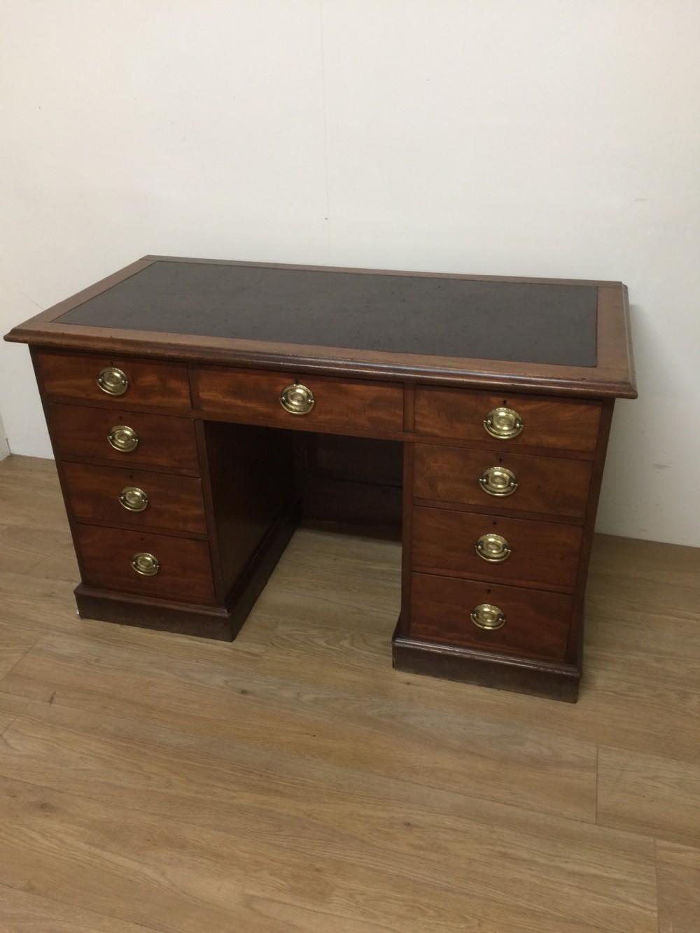 Nineteenth century mahogany twin Pedestal desk with brass oval plate handles View X