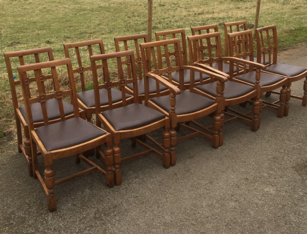 Set of 12 Arts and crafts golden oak dining chairs 