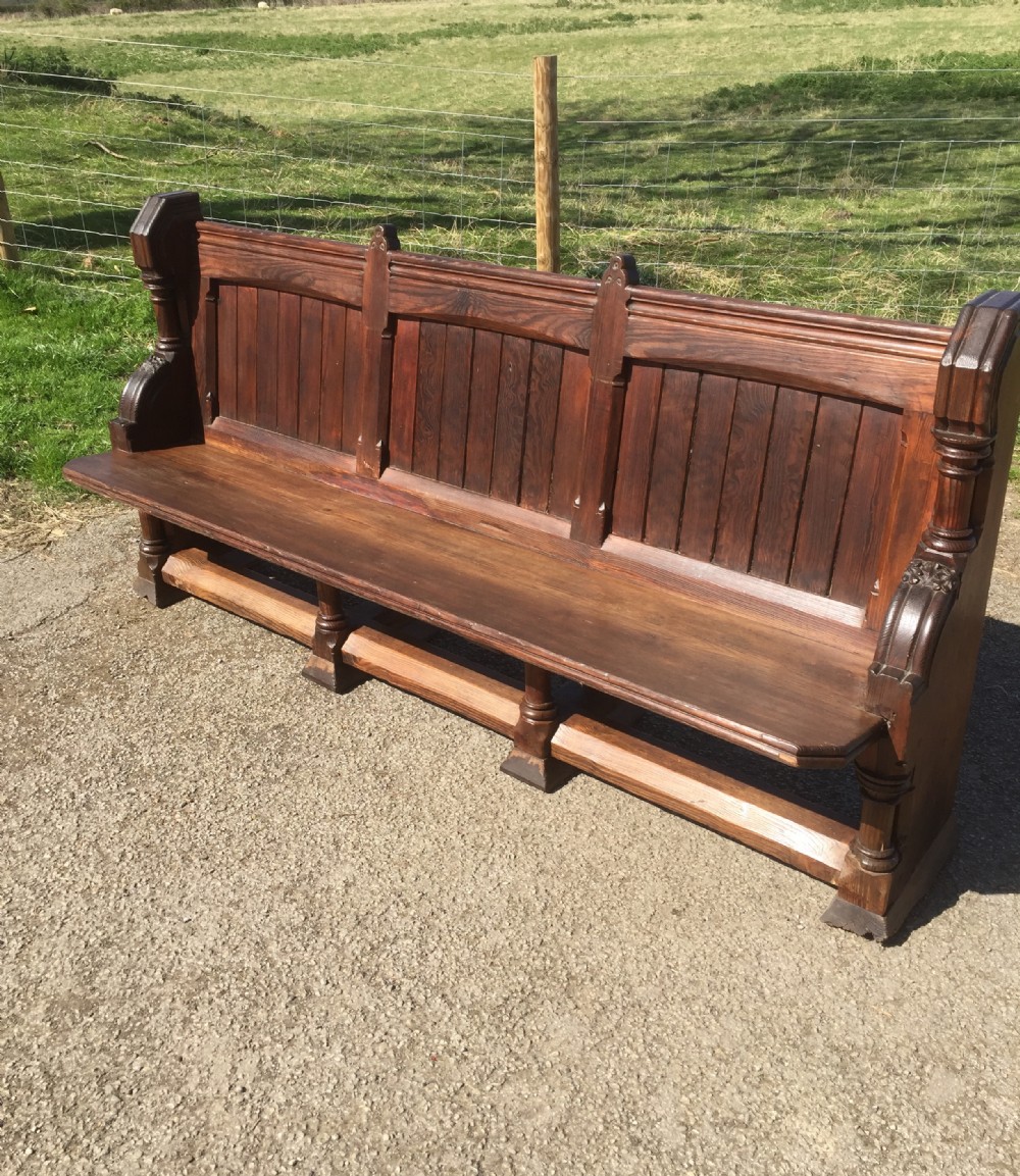 Nineteenth century carved pitch pine pew with panelled back 