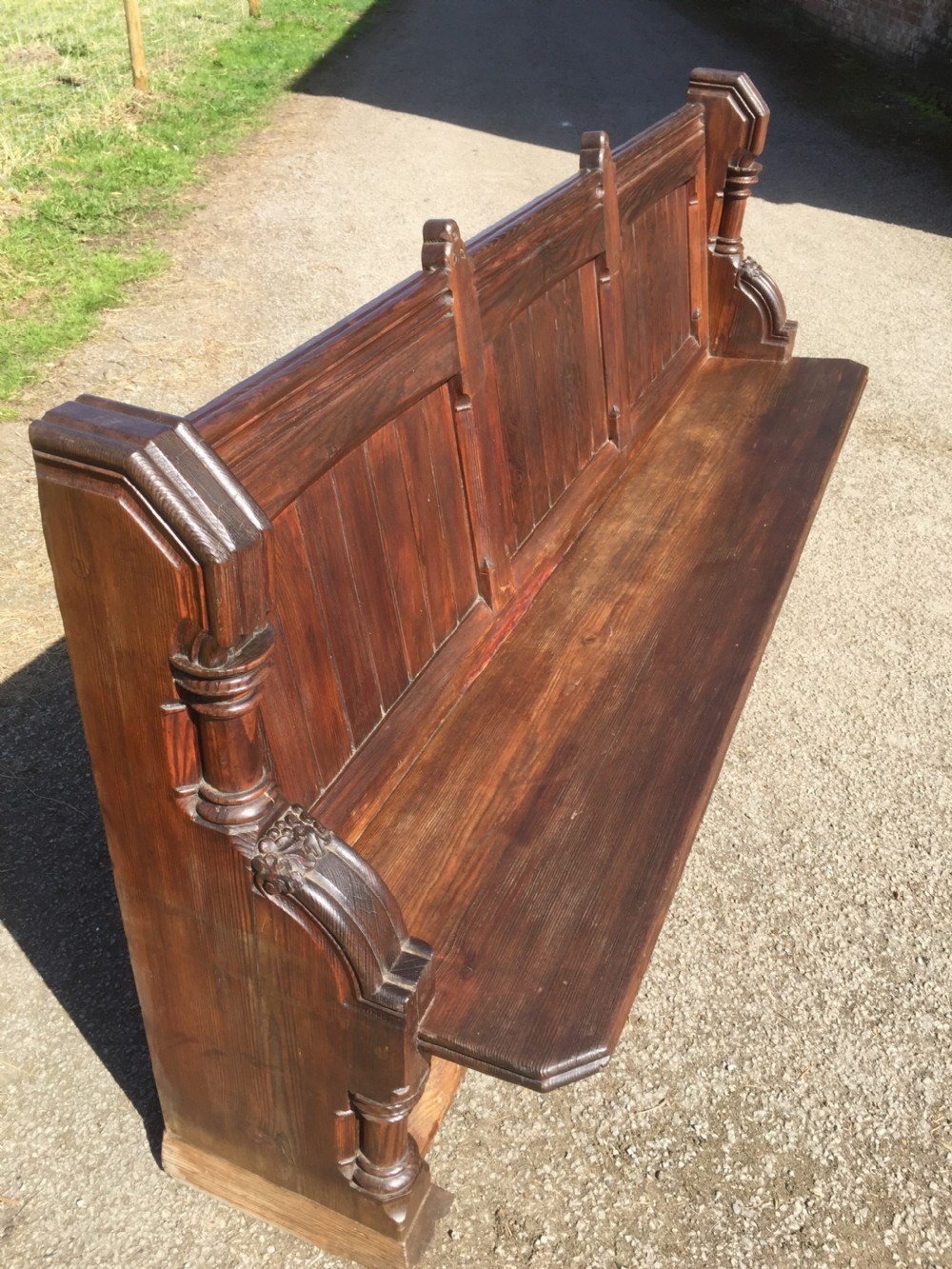 Nineteenth century carved pitch pine pew with panelled back  View V