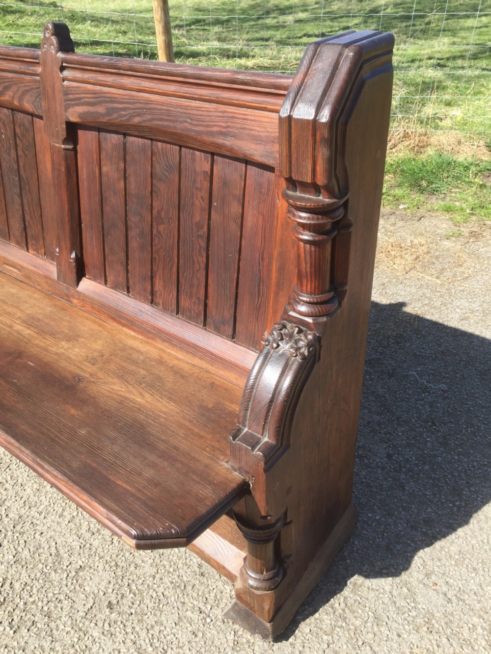 Nineteenth century carved pitch pine pew with panelled back  View IX