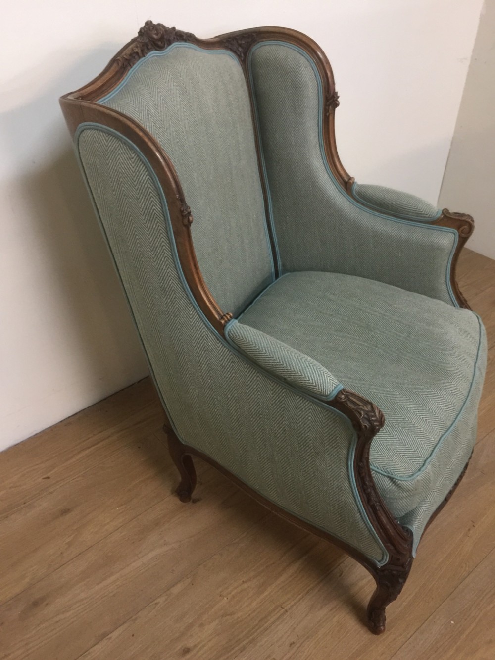 Nineteenth century French carved walnut winged armchair 