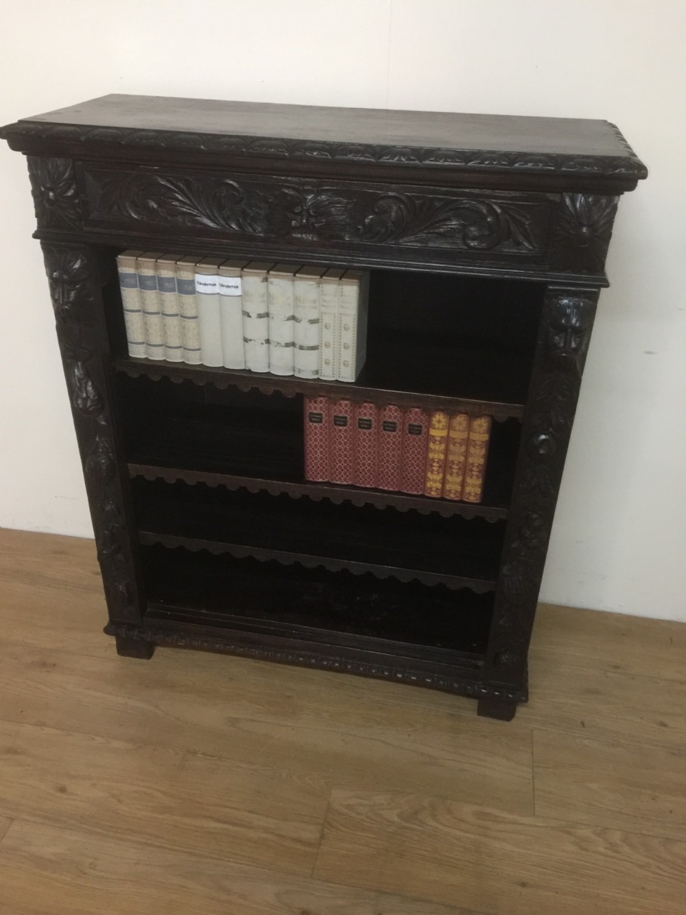 Nineteenth century green man solid oak carved open bookcase