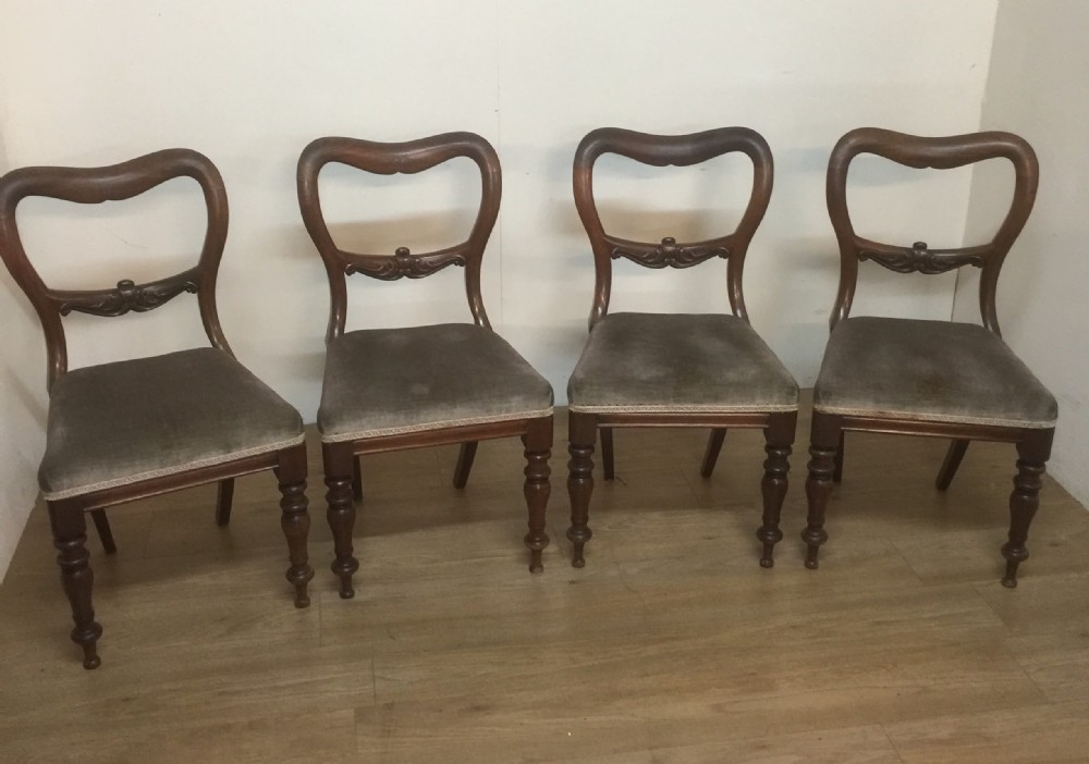 Four nineteenth century mahogany balloon back chairs