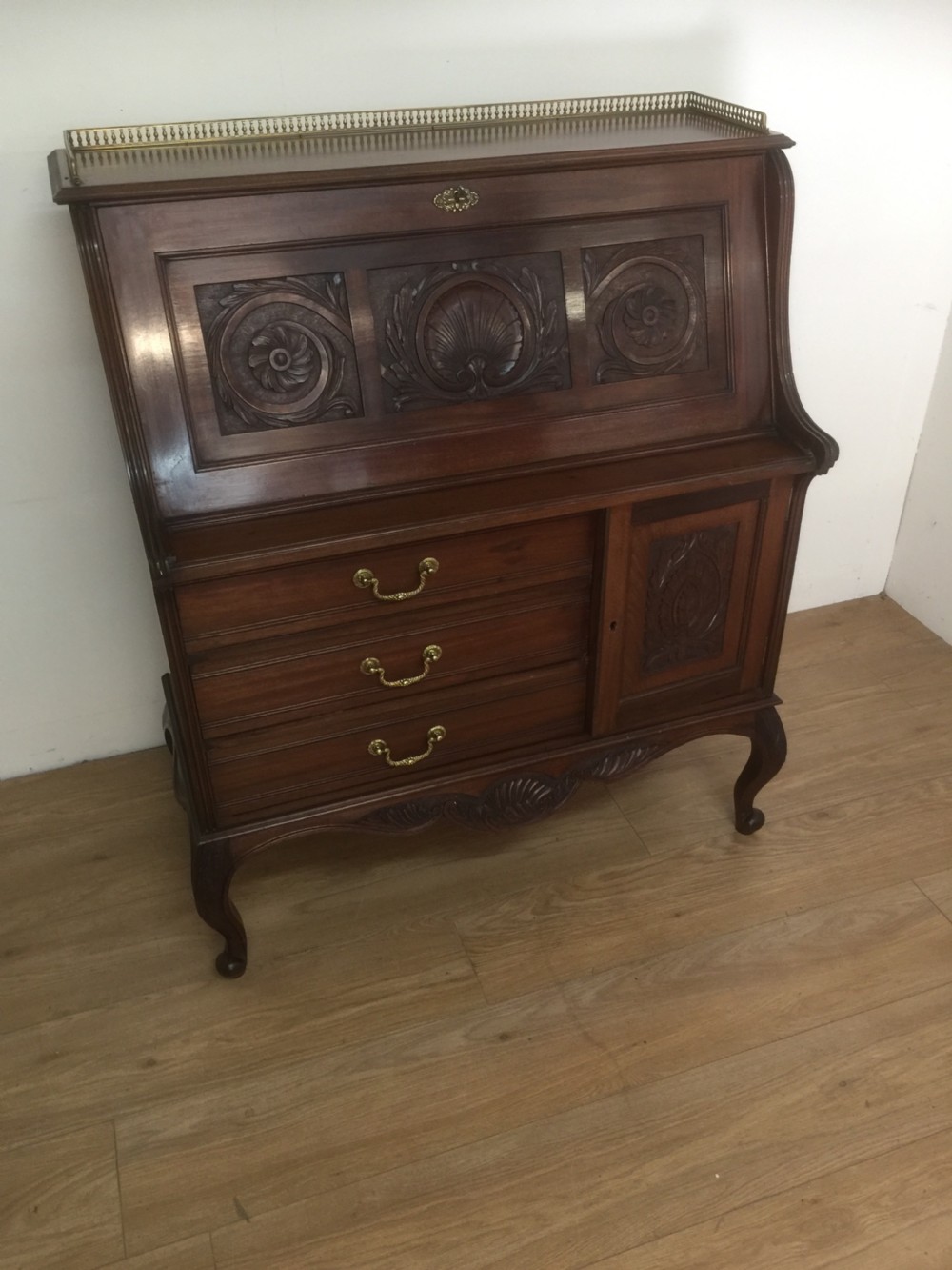 Nineteenth century carved mahogany bureau on cabriole legs 