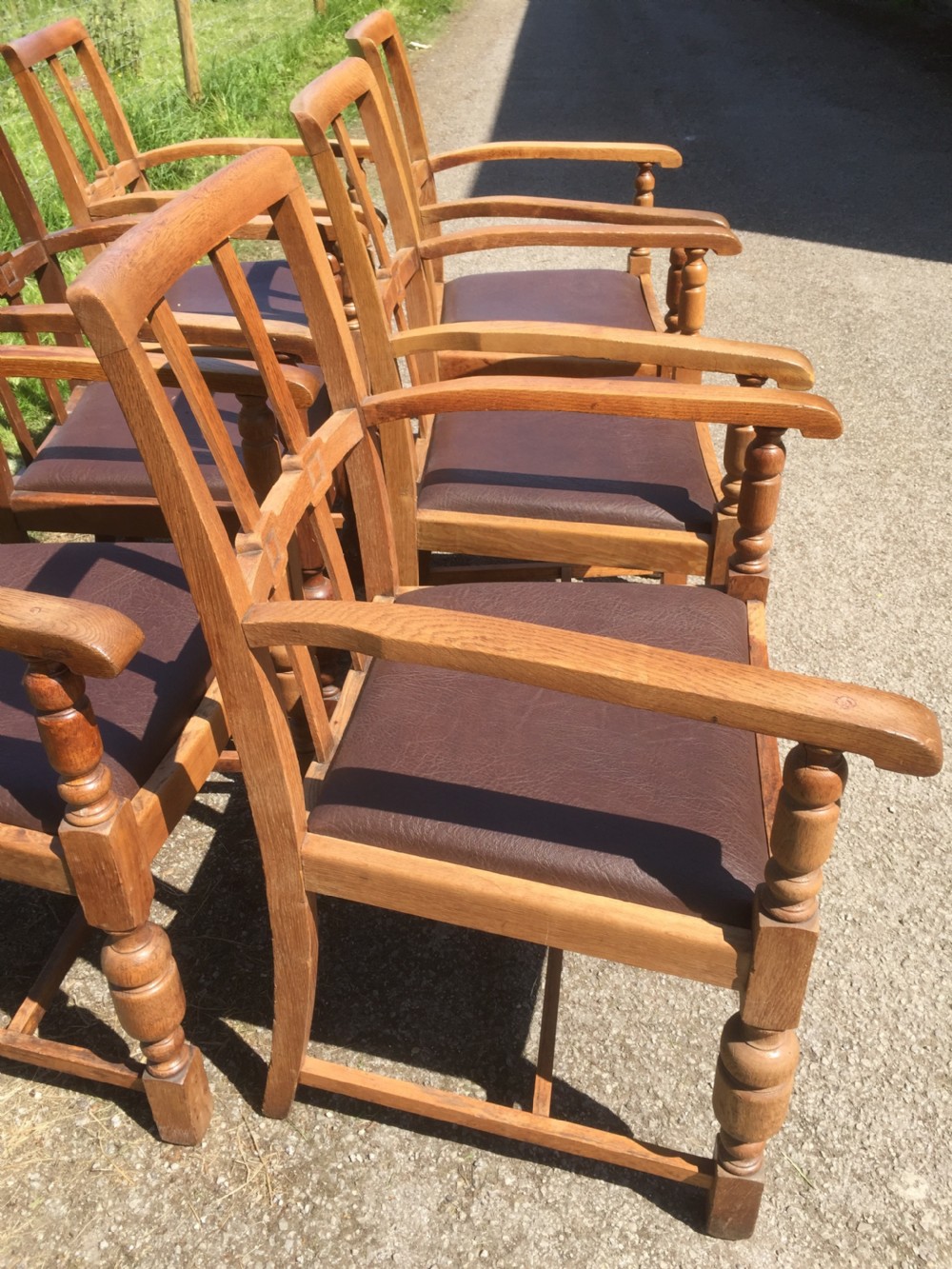 Six golden oak Arts and Crafts armchairs  View VIII