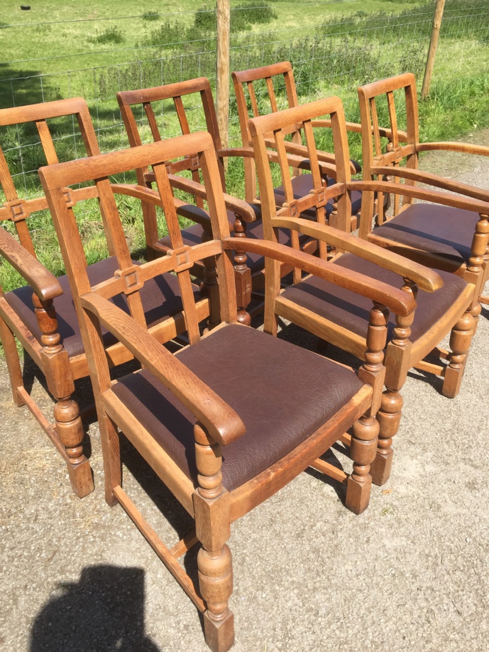 Six golden oak Arts and Crafts armchairs  View IX