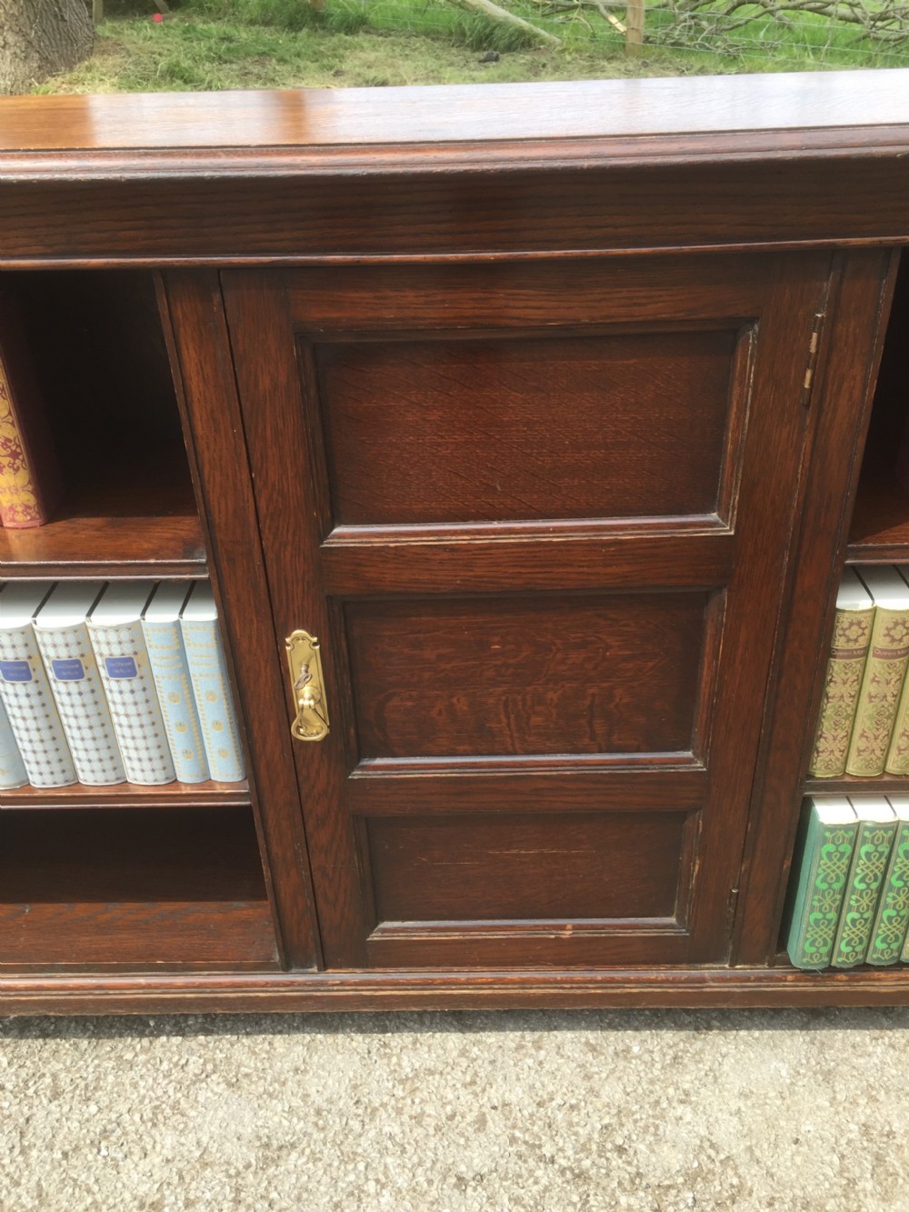 Pair of Waring and Gillow solid oak open bookcases circa 1920 View IV
