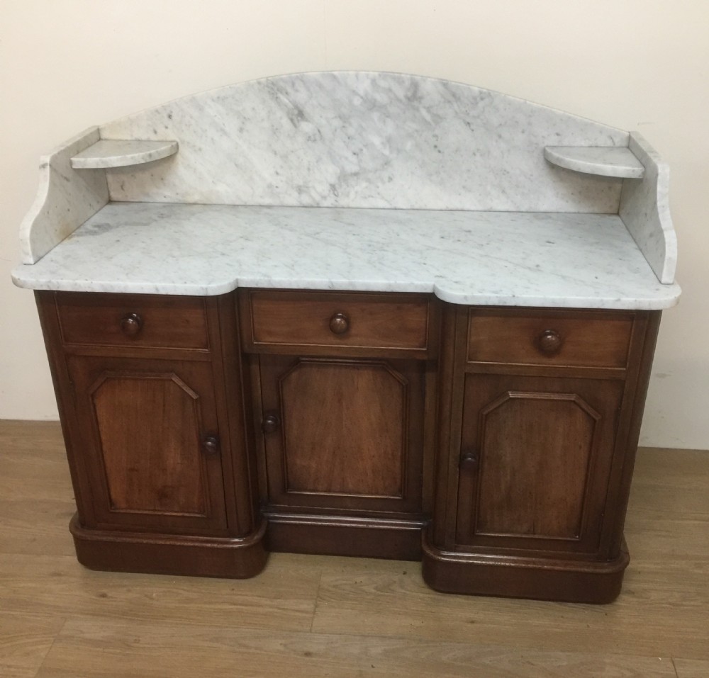 Nineteenth century mahogany washstand with white carrara marble top 