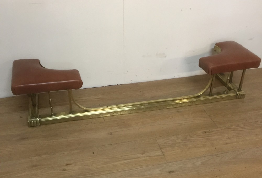 Edwardian leather and brass club fender