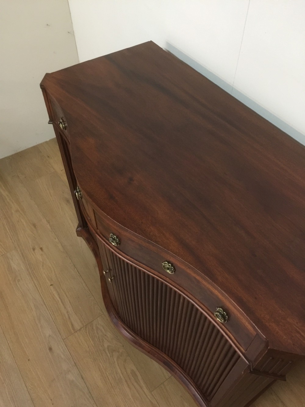 Nineteenth century serpentine fronted tambour cabinet  View IV