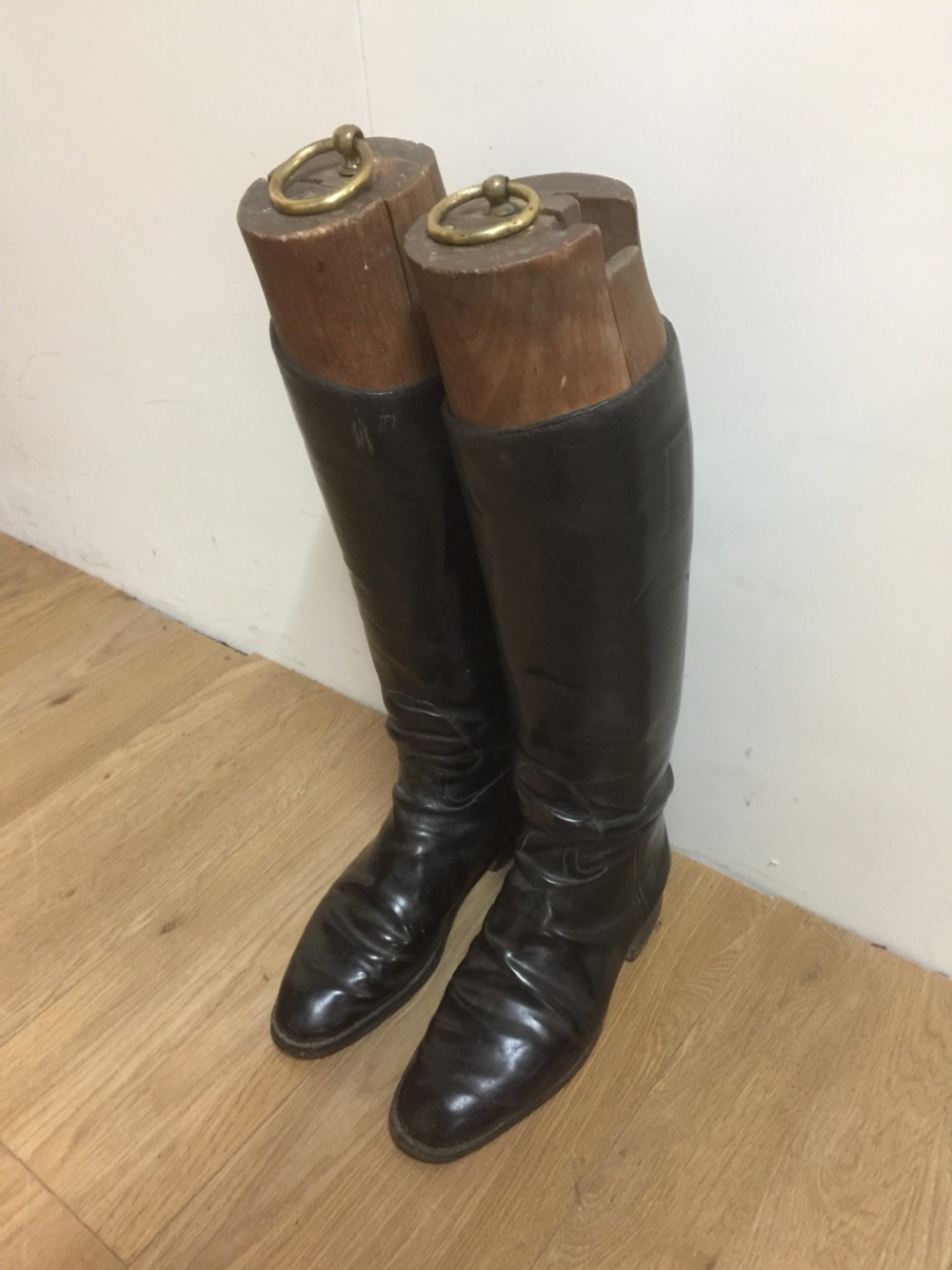 Antique pair of leather riding boots with trees 