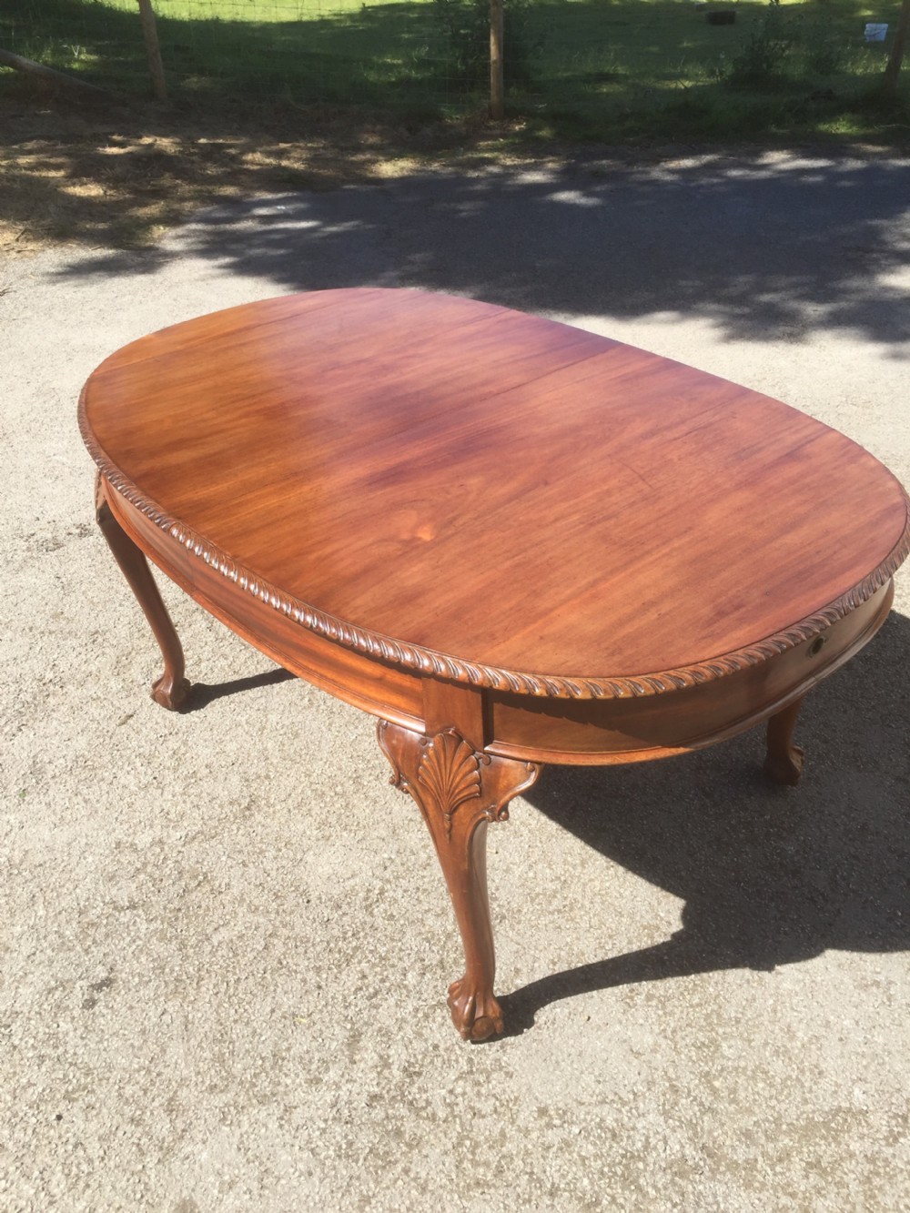 Edwardian eight seater walnut wind out dining table on cabriole legs  View X