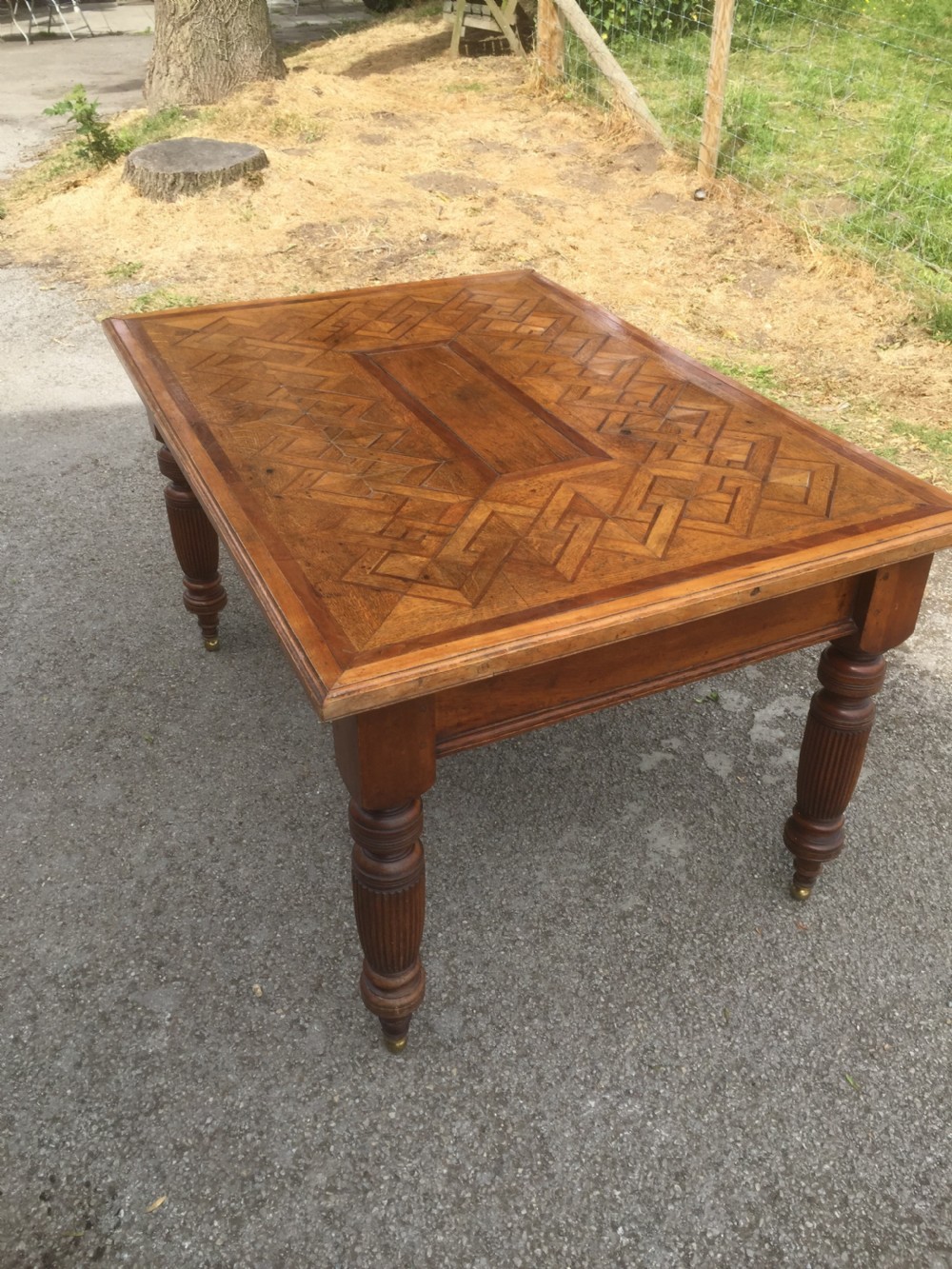 Nineteenth century oak parquetry six seater table on turned and reeded legs  View II