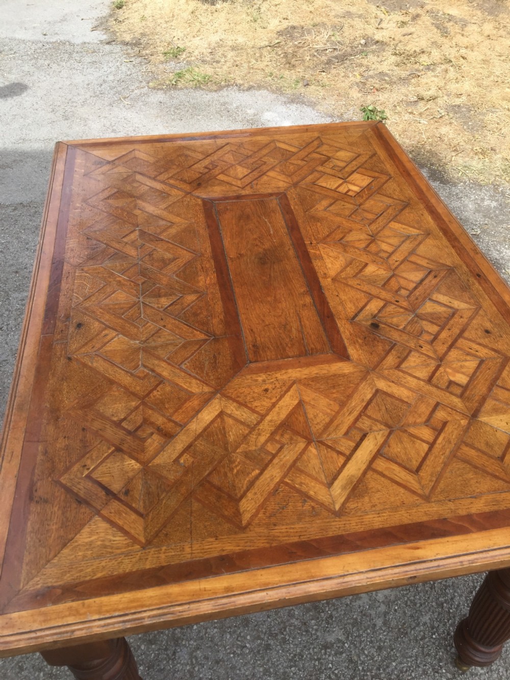 Nineteenth century oak parquetry six seater table on turned and reeded legs  View III