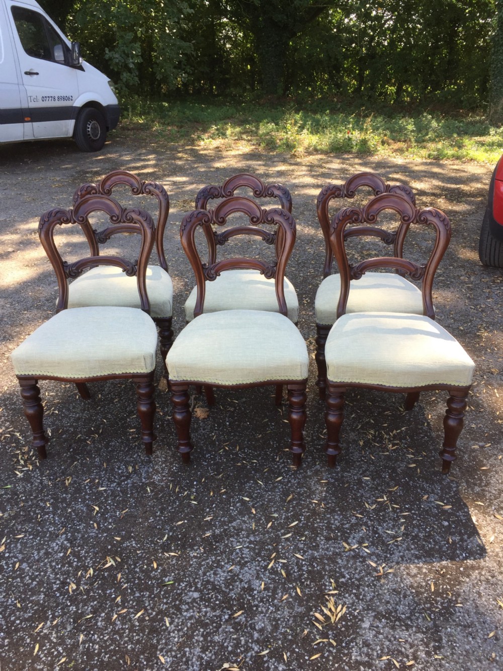Six nineteenth century carved mahogany balloon backed dining chairs  View V