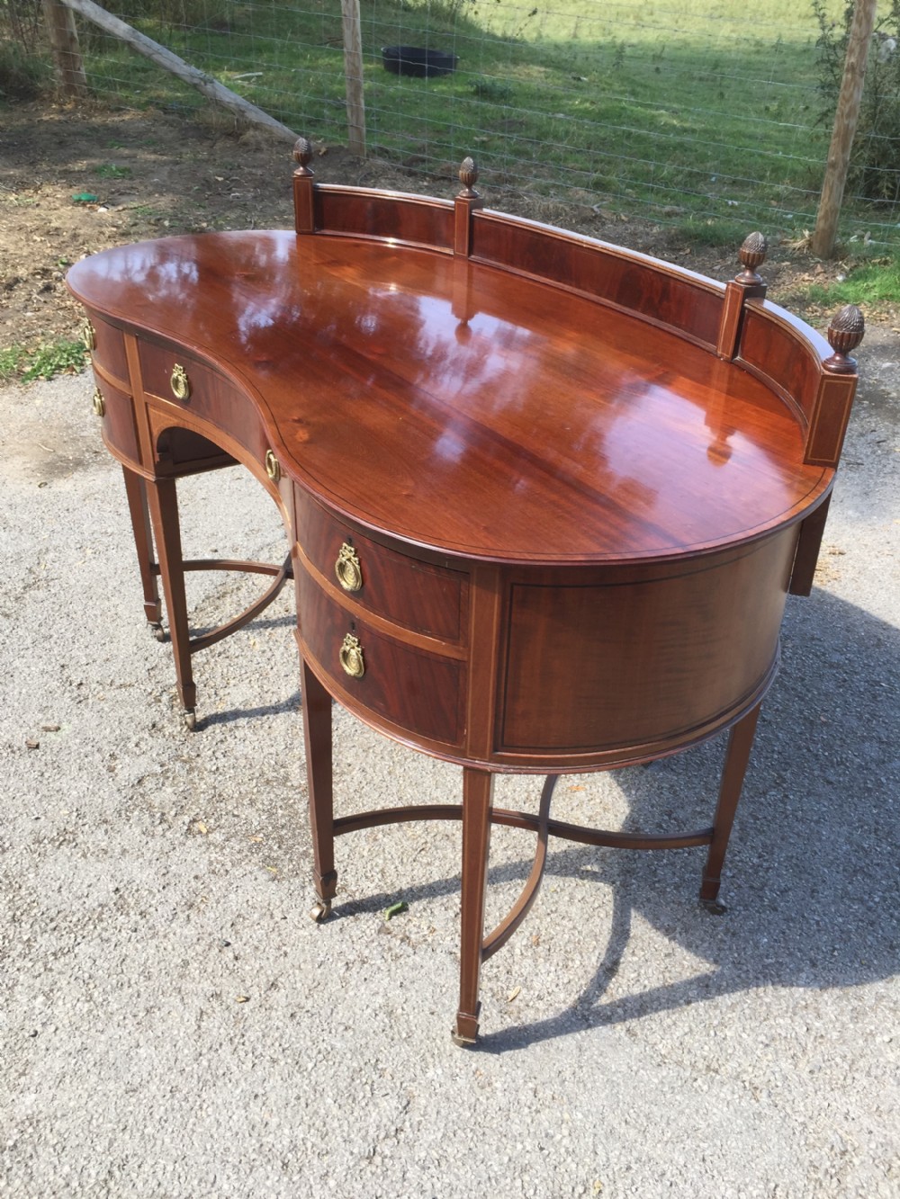 Nineteenth century inlaid mahogany kidney shaped desk View XII