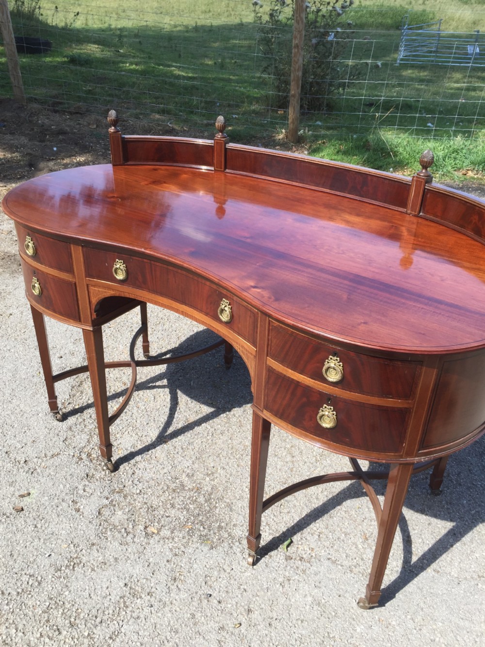 Nineteenth century inlaid mahogany kidney shaped desk View XIII