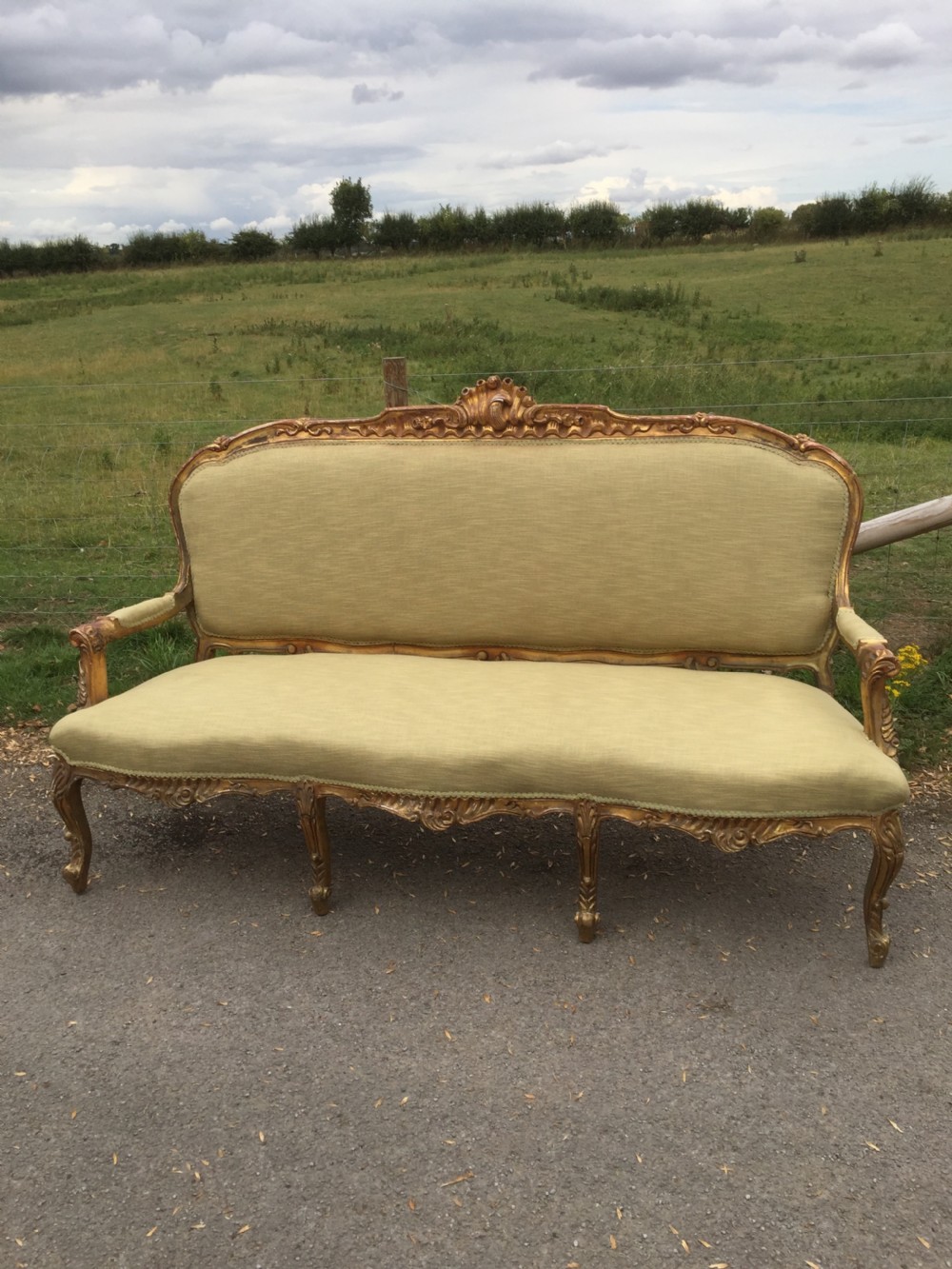 French three seater sofa with carved and gilded frame circa 1900