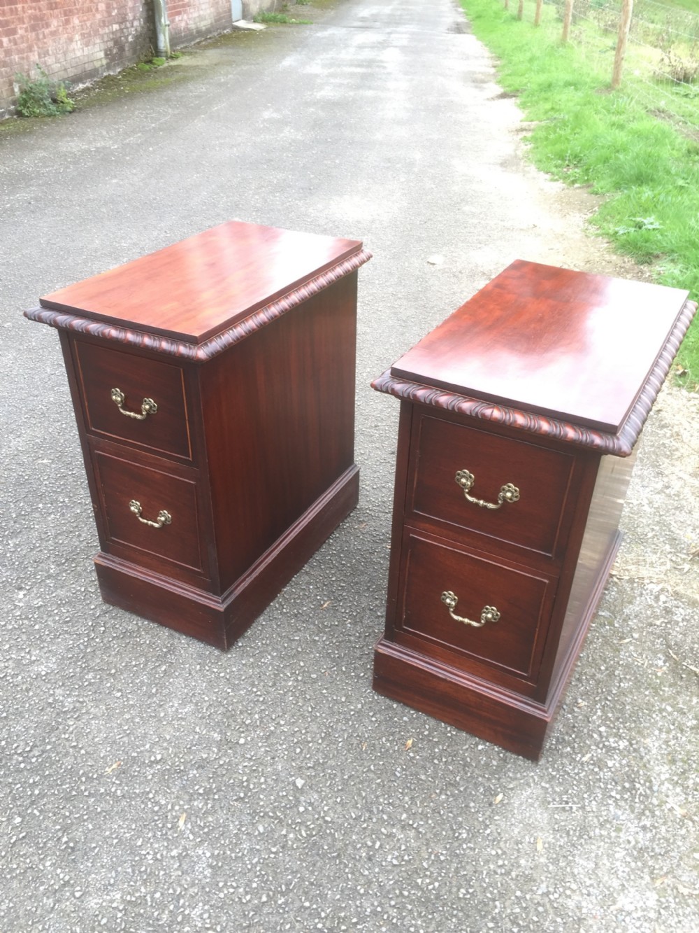 Pair of mahogany bedside cabinets with flame mahogany tops circa 1920