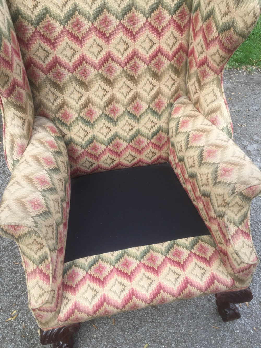 Edwardian traditionally upholstered winged armchair on carved ball and claw feet View VIII