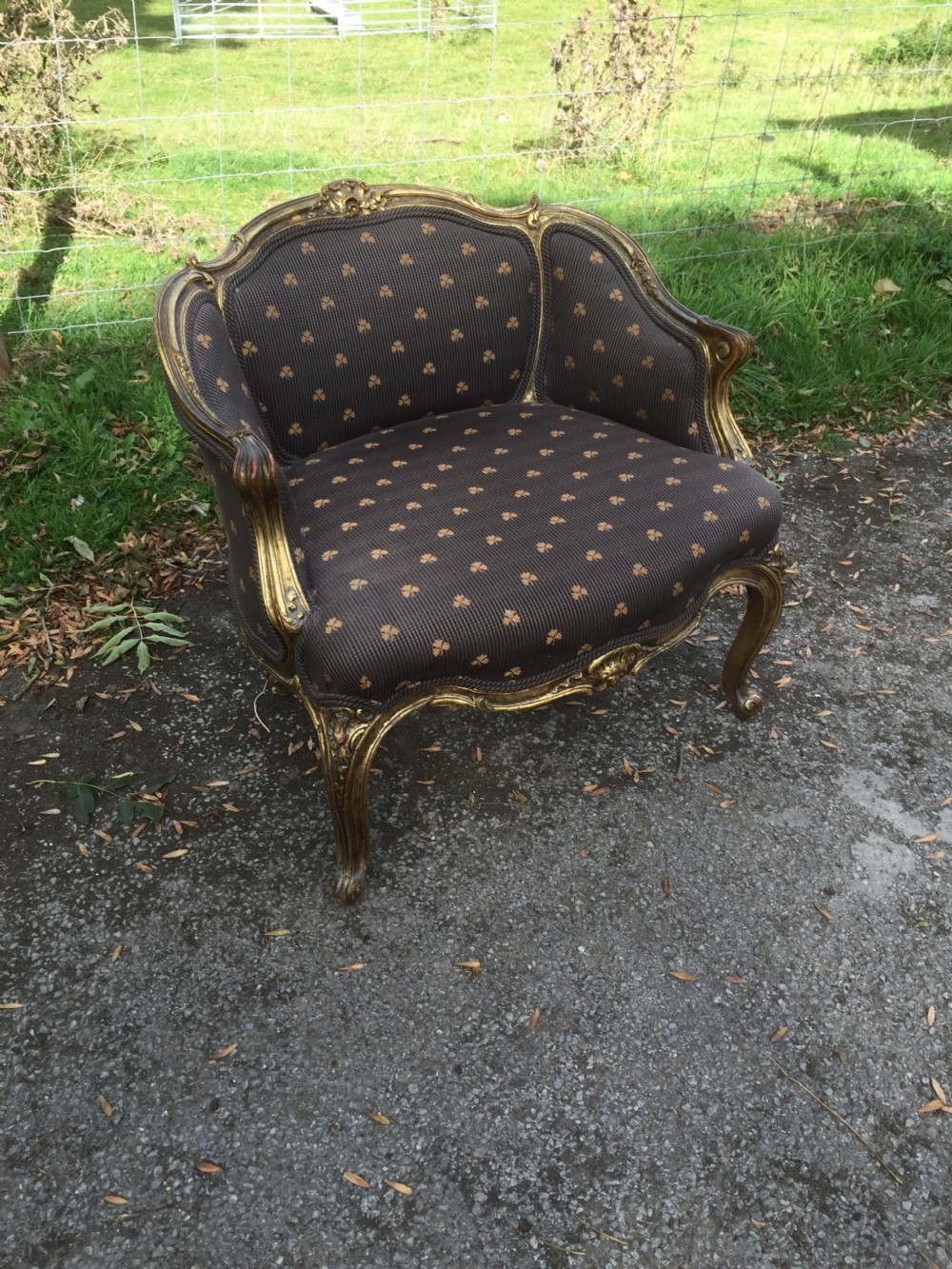 Late nineteenth century French armchair with scrolling gilt frame 