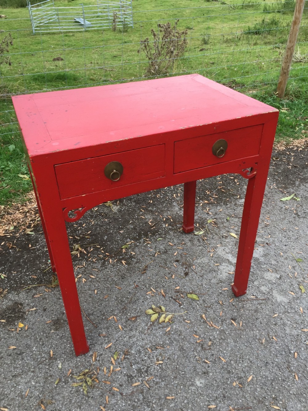 Antique red Chinese lacquer two drawer table circa 1920