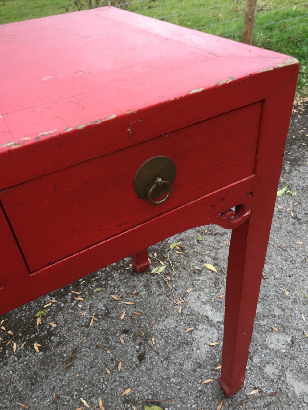 Antique red Chinese lacquer two drawer table circa 1920 View II