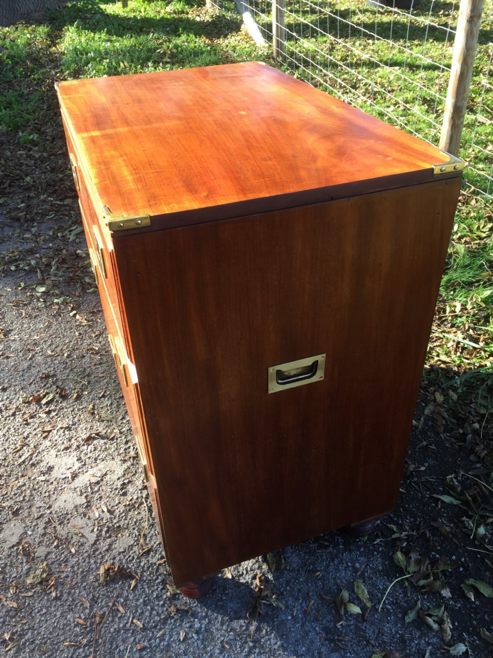 Military style three height chest of drawers on bun feet circa 1920  View II
