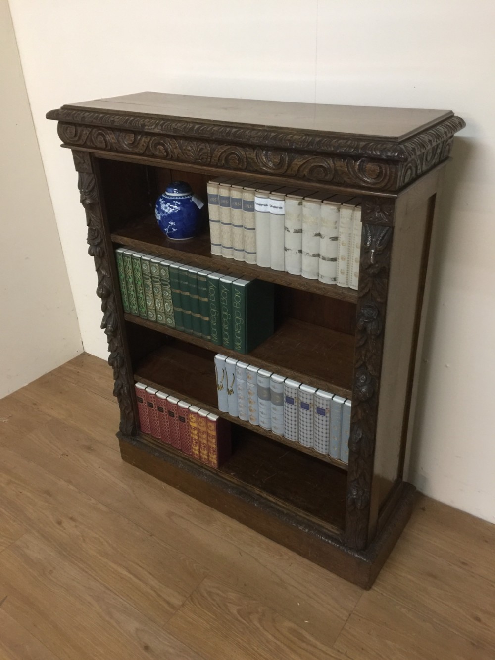 Nineteenth century carved oak open bookshelves with adjustable shelves  View II