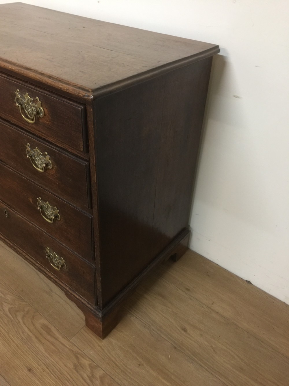 Small Georgian oak chest of drawers on bracket feet  View III