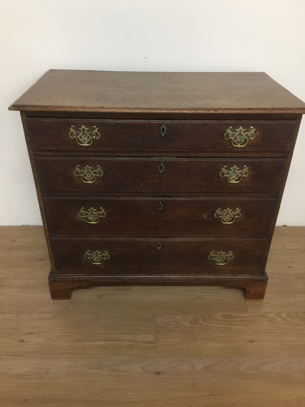 Small Georgian oak chest of drawers on bracket feet  View VIII