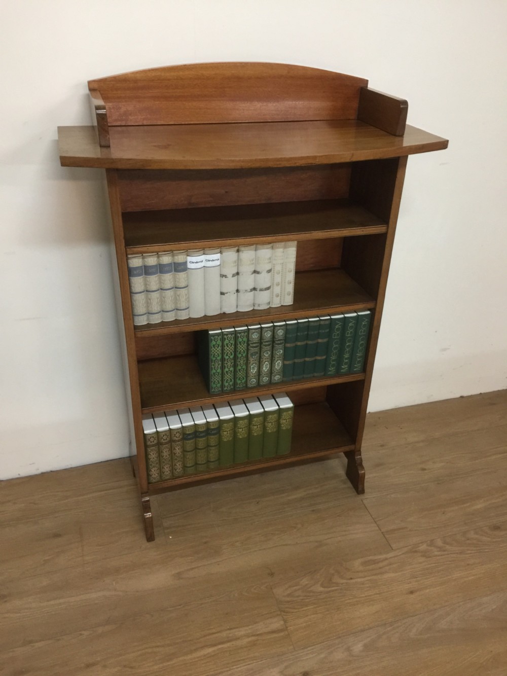 Arts and crafts freestanding open bookshelves in faded walnut