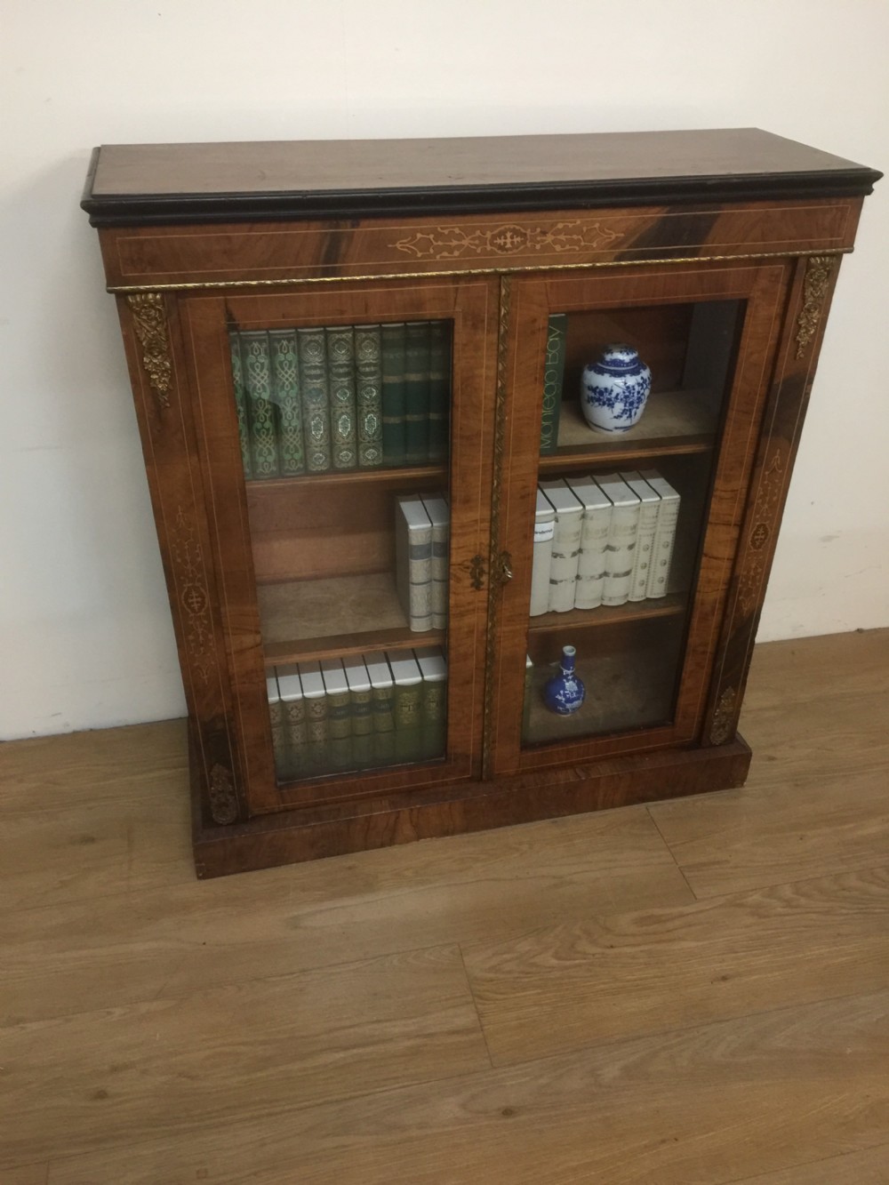 Nineteenth century walnut inlaid ormolu mounted pier cabinet 