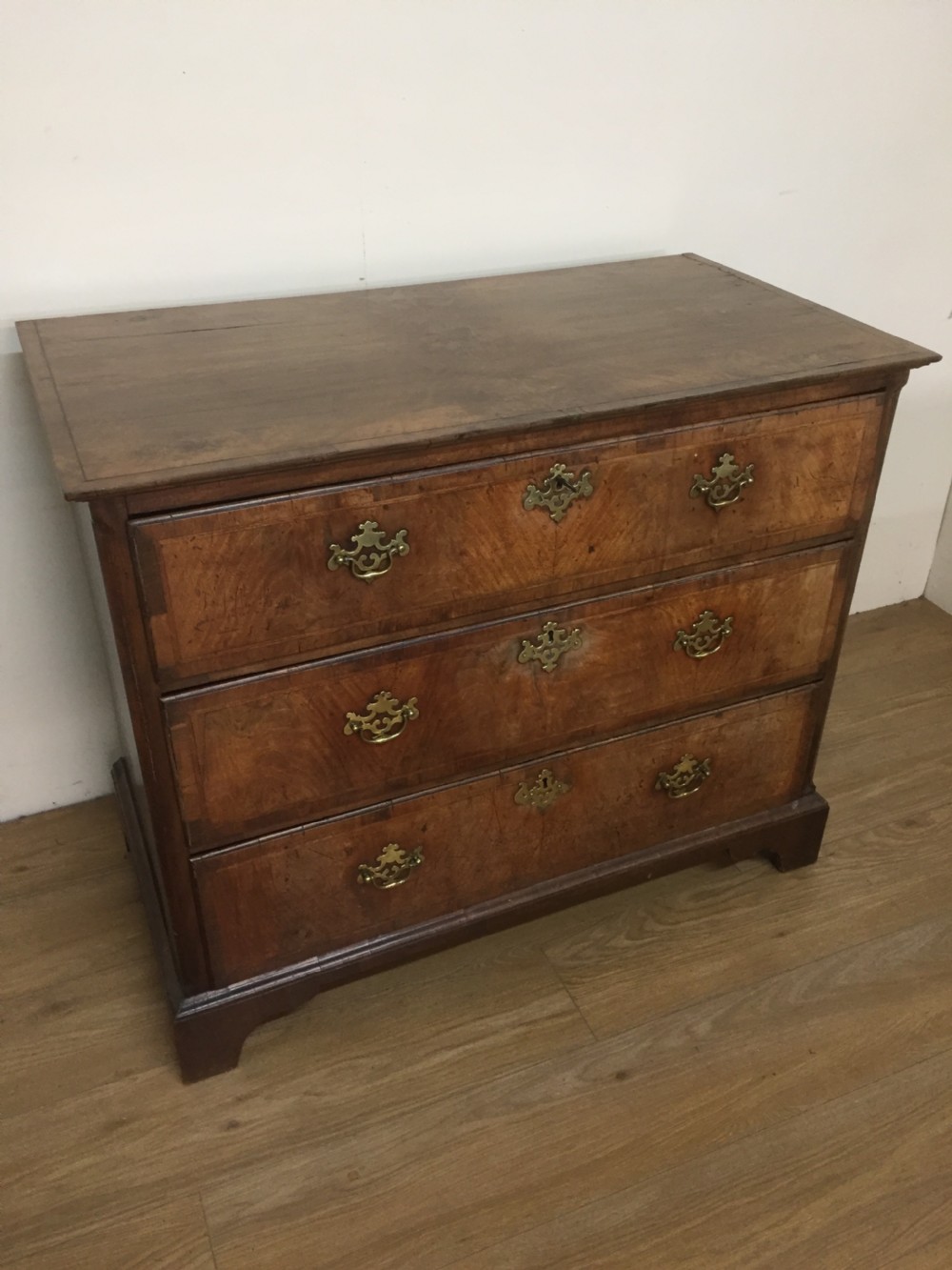 Late eighteenth century walnut crossbanded chest of drawers 