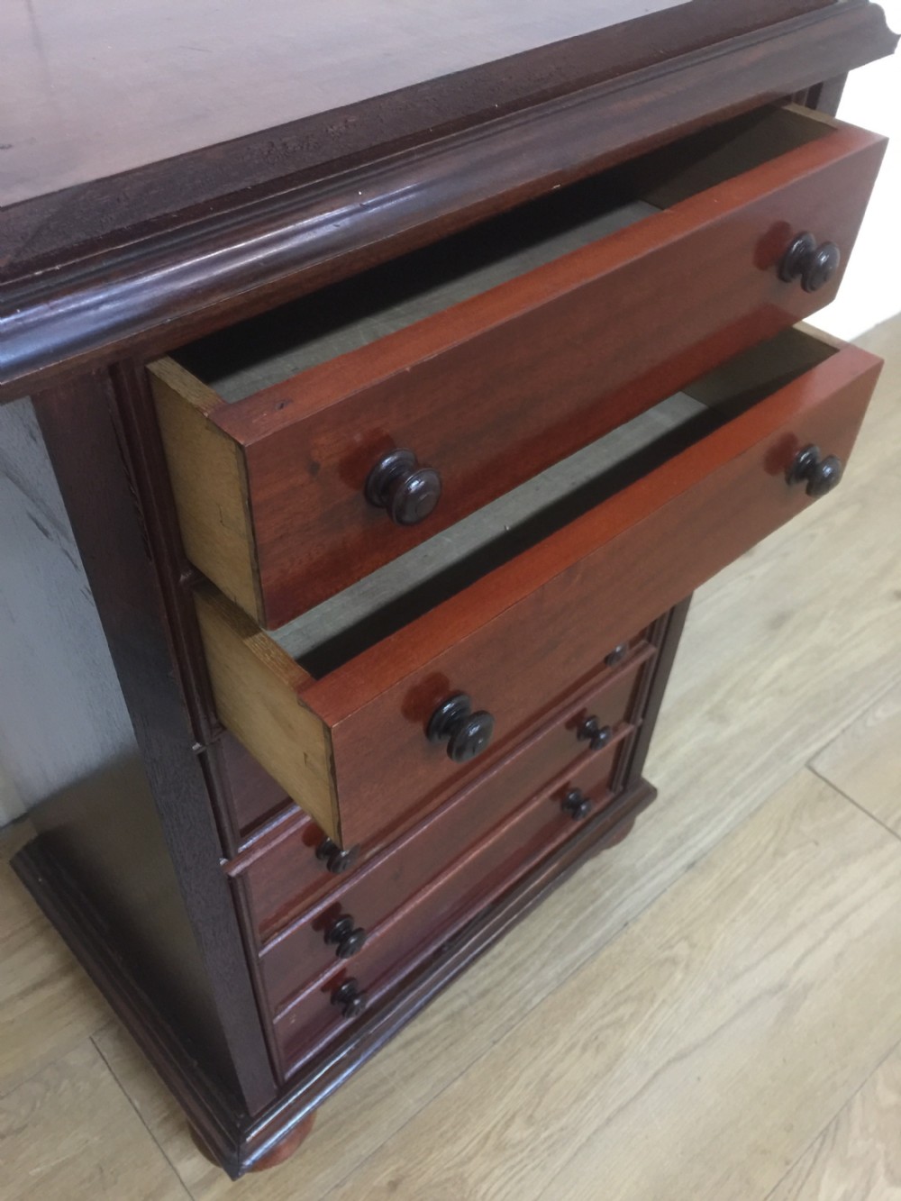 Small bank of mahogany drawers  65 cm high  View V