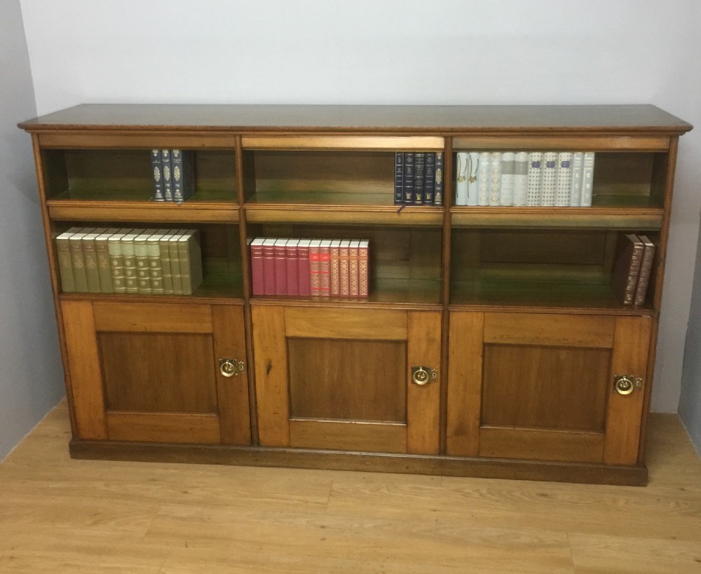 Arts and crafts walnut bookcase over cupboard circa 1890