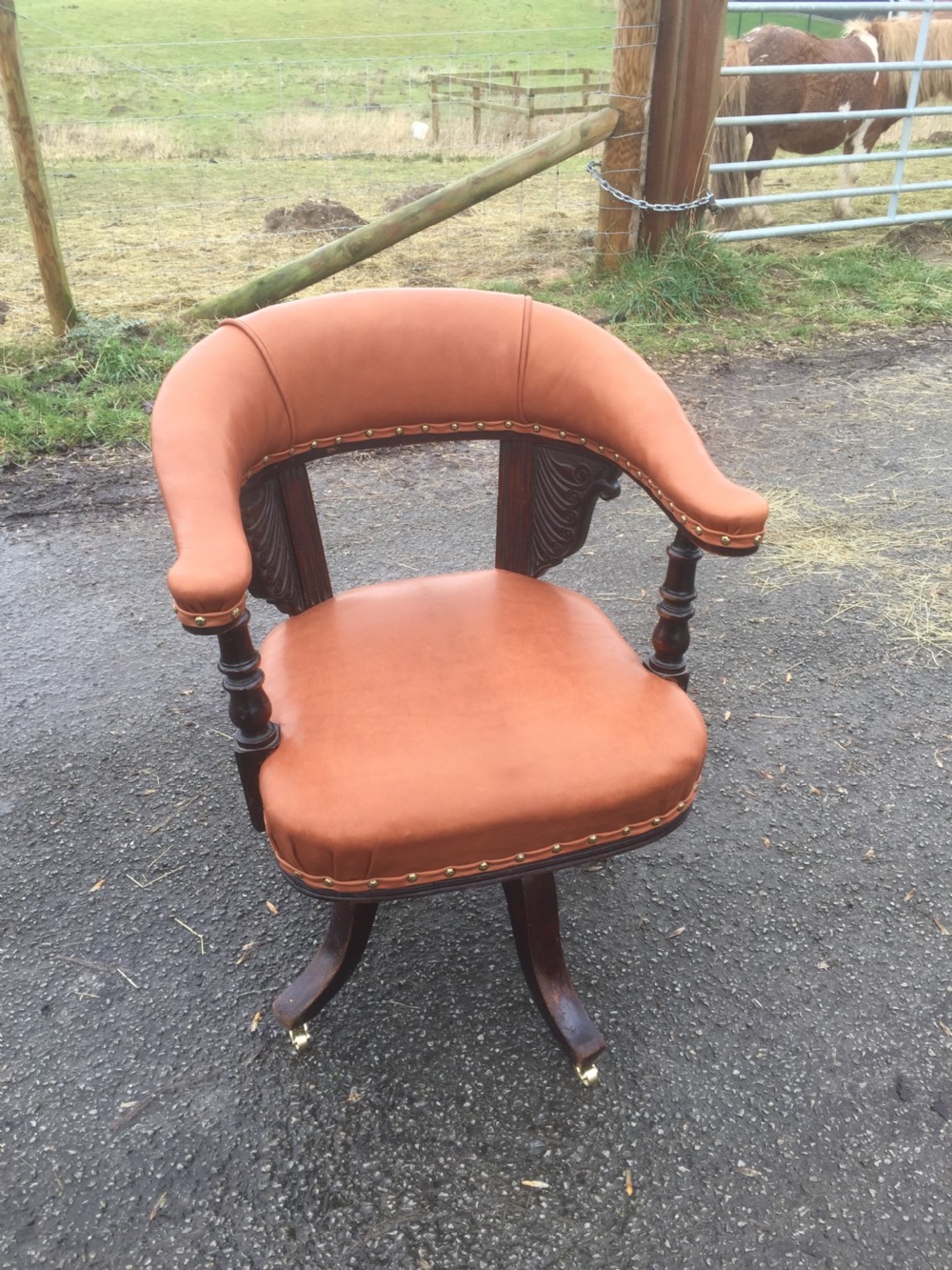 Nineteenth century swivel desk chair in tan hide  View X