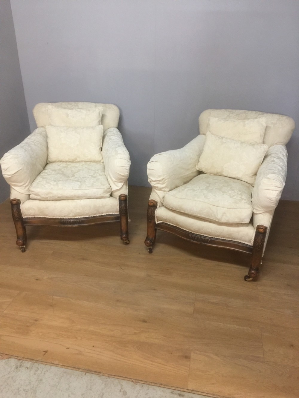Pair of carved country house armchairs with feather cushions View II