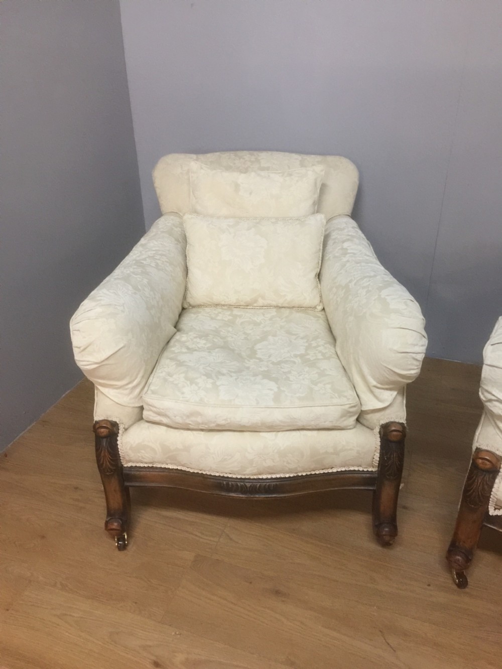 Pair of carved country house armchairs with feather cushions View III