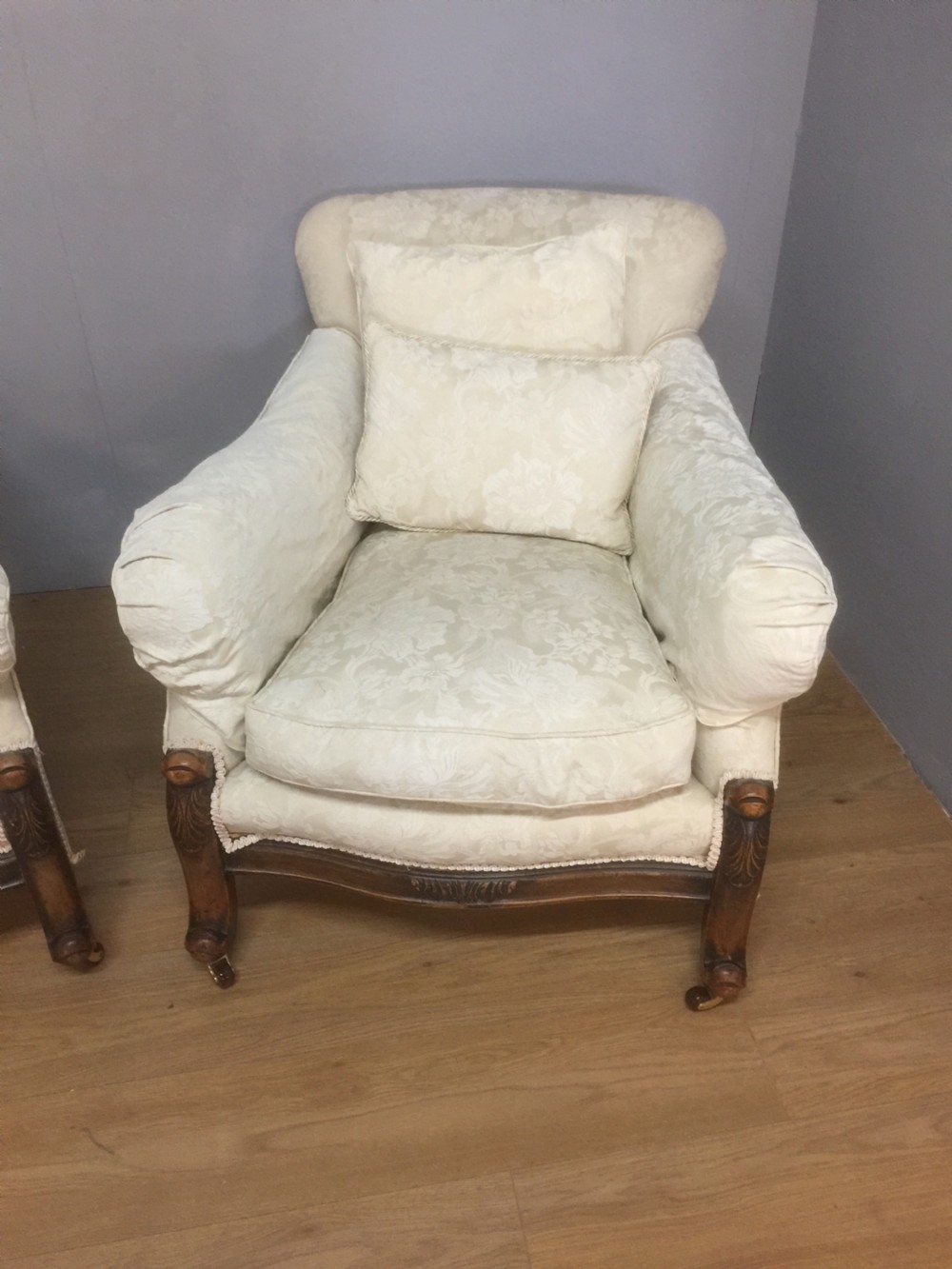 Pair of carved country house armchairs with feather cushions View IV