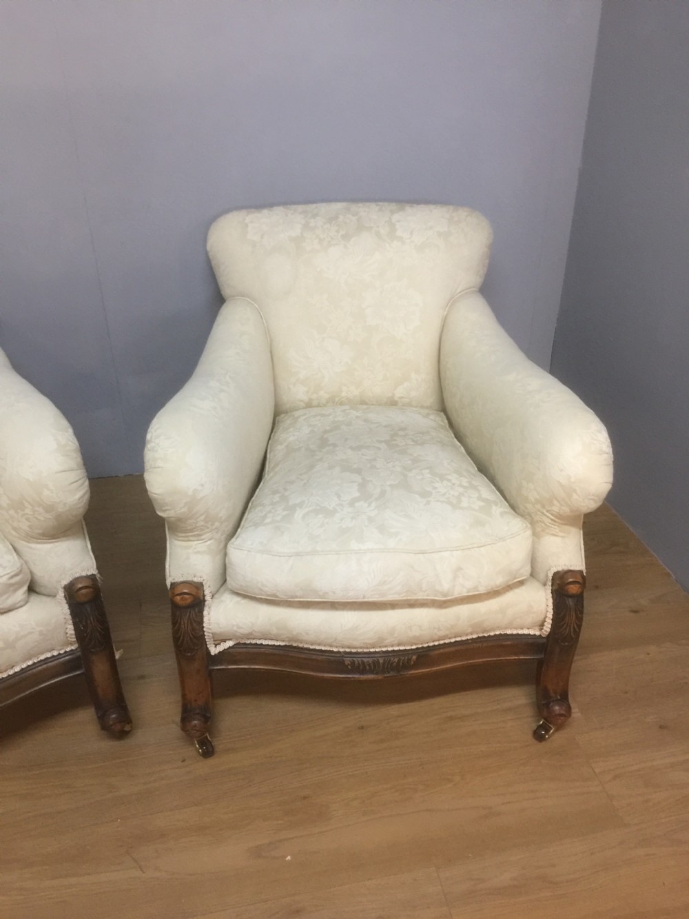 Pair of carved country house armchairs with feather cushions View IX