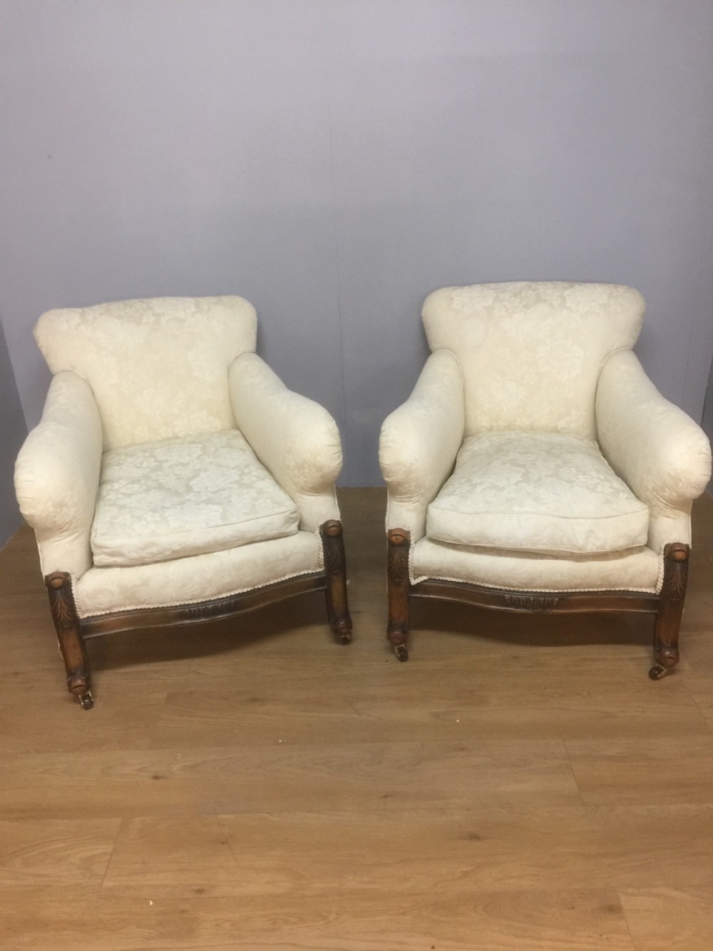 Pair of carved country house armchairs with feather cushions View XI